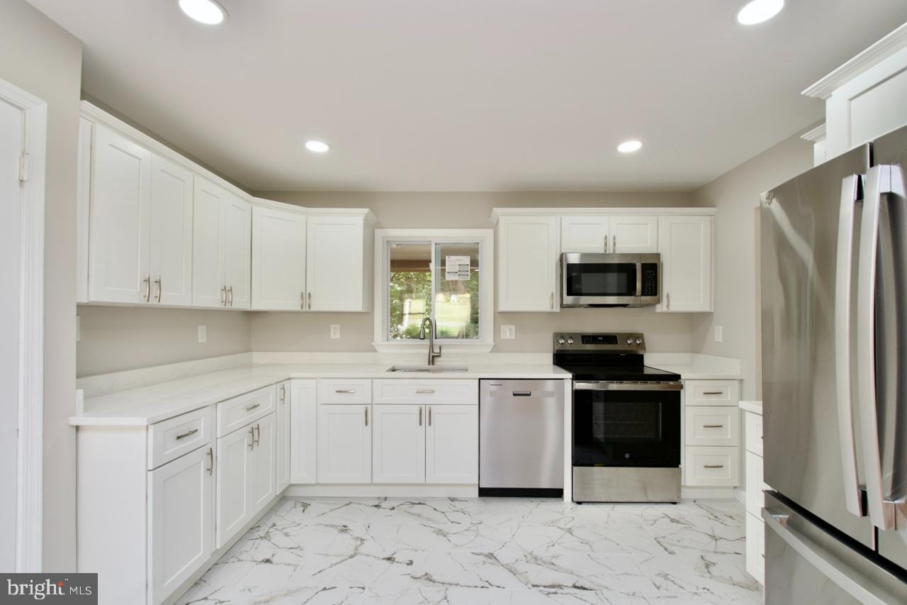 5708 Norton Road Alexandria, VA 22303 - Photo 1 of 49 Modern kitchen with sleek finishes.