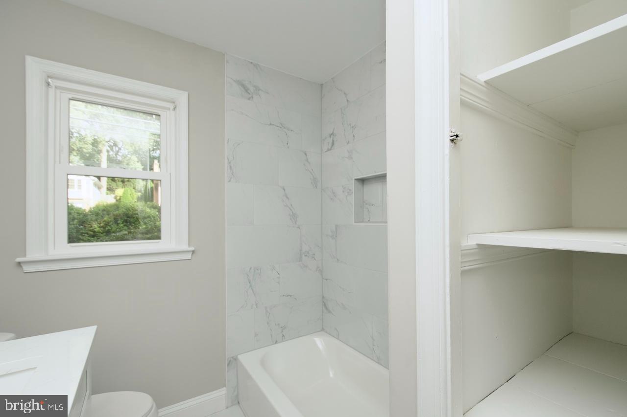 5708 Norton Road Alexandria, VA 22303 - Photo 21 of 49 Modern bathroom with elegant marble accents.