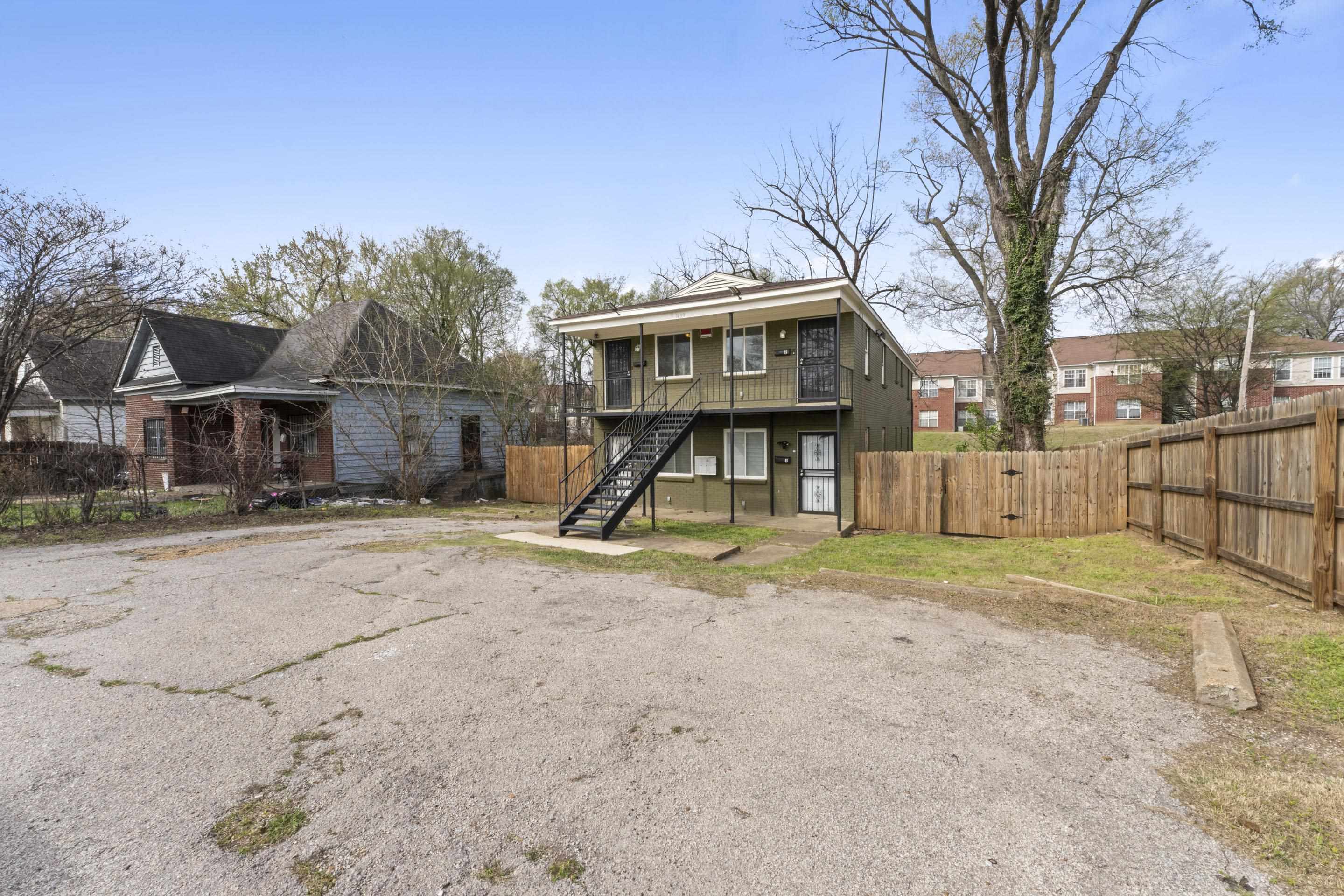 1493 Gaither Street Memphis, TN 38106 - Photo 13 of 27 a view of a yard with a house and a tree
