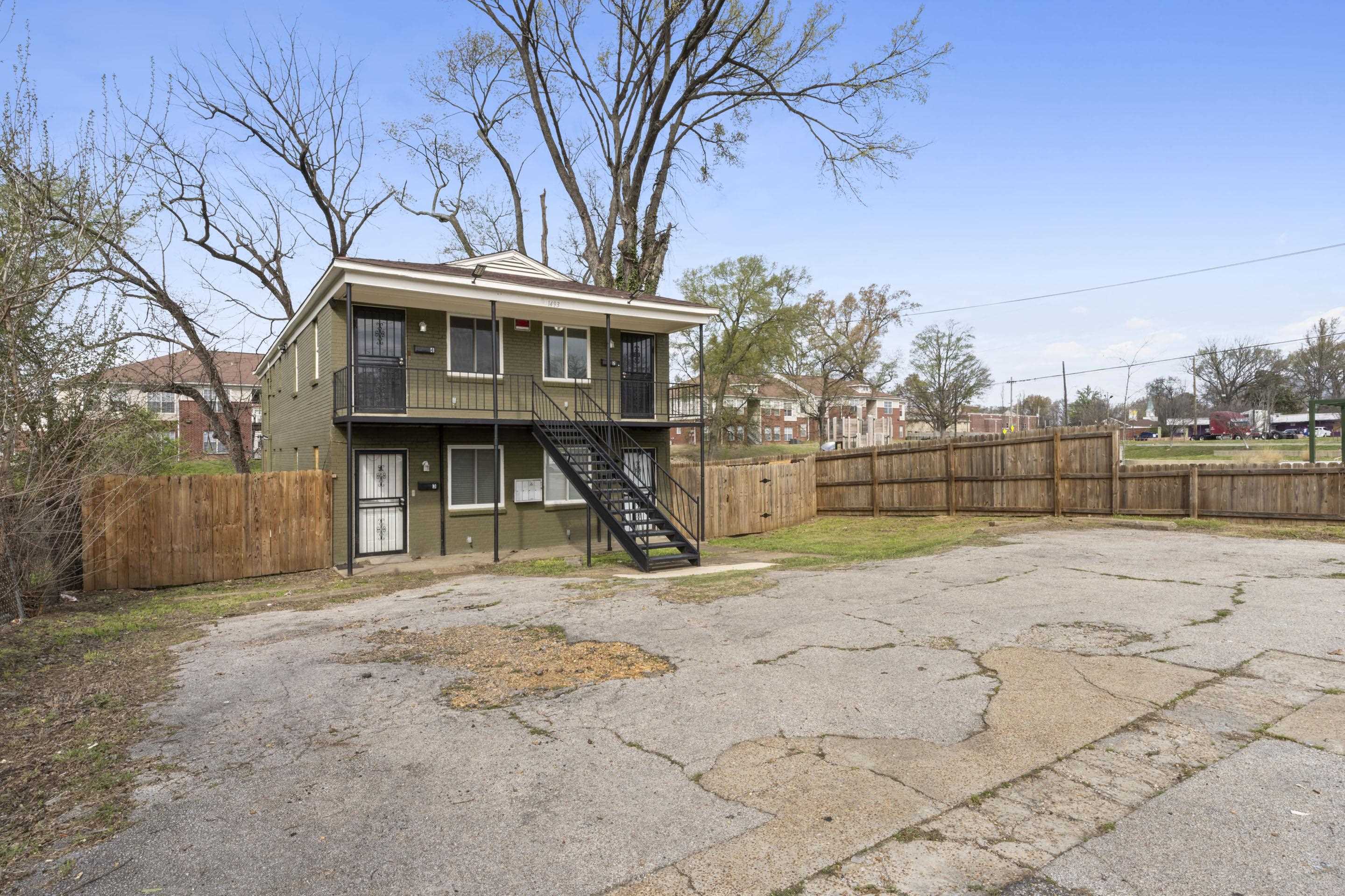 1493 Gaither Street Memphis, TN 38106 - Photo 14 of 27 a view of a yard with wooden fence