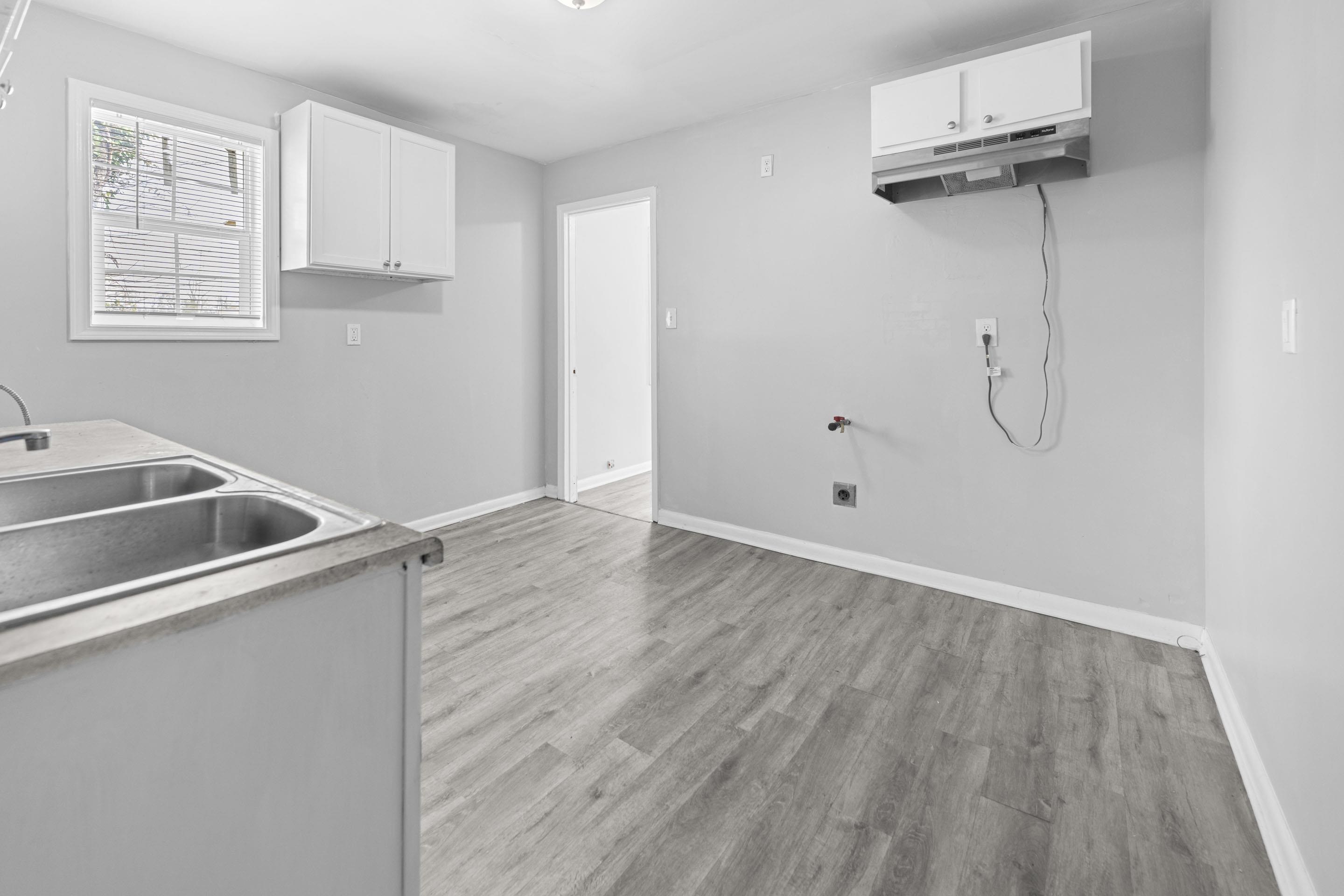 1493 Gaither Street Memphis, TN 38106 - Photo 25 of 27 a view of a room with wooden floor and white walls