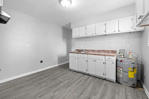 a view of cabinets and wooden floor