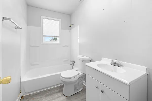 a bathroom with a sink toilet and bathtub