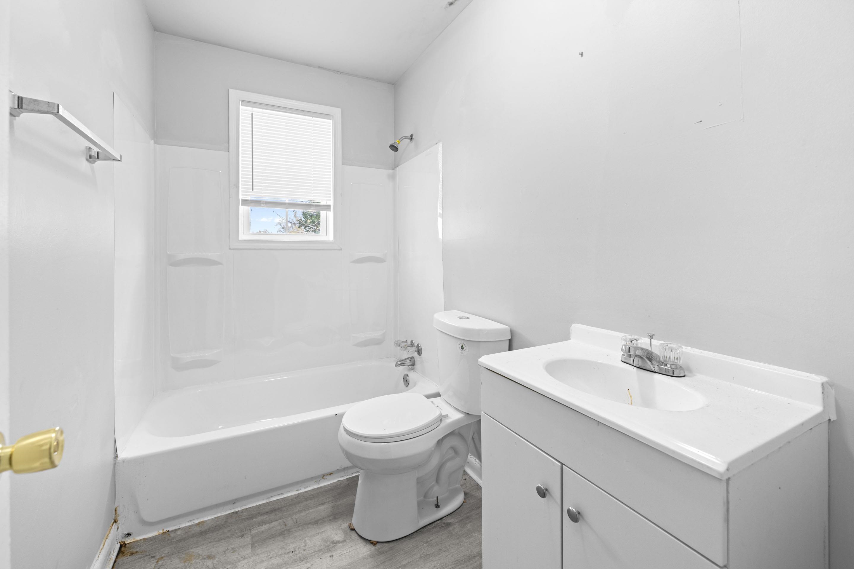 1493 Gaither Street Memphis, TN 38106 - Photo 9 of 27 a bathroom with a sink toilet and bathtub