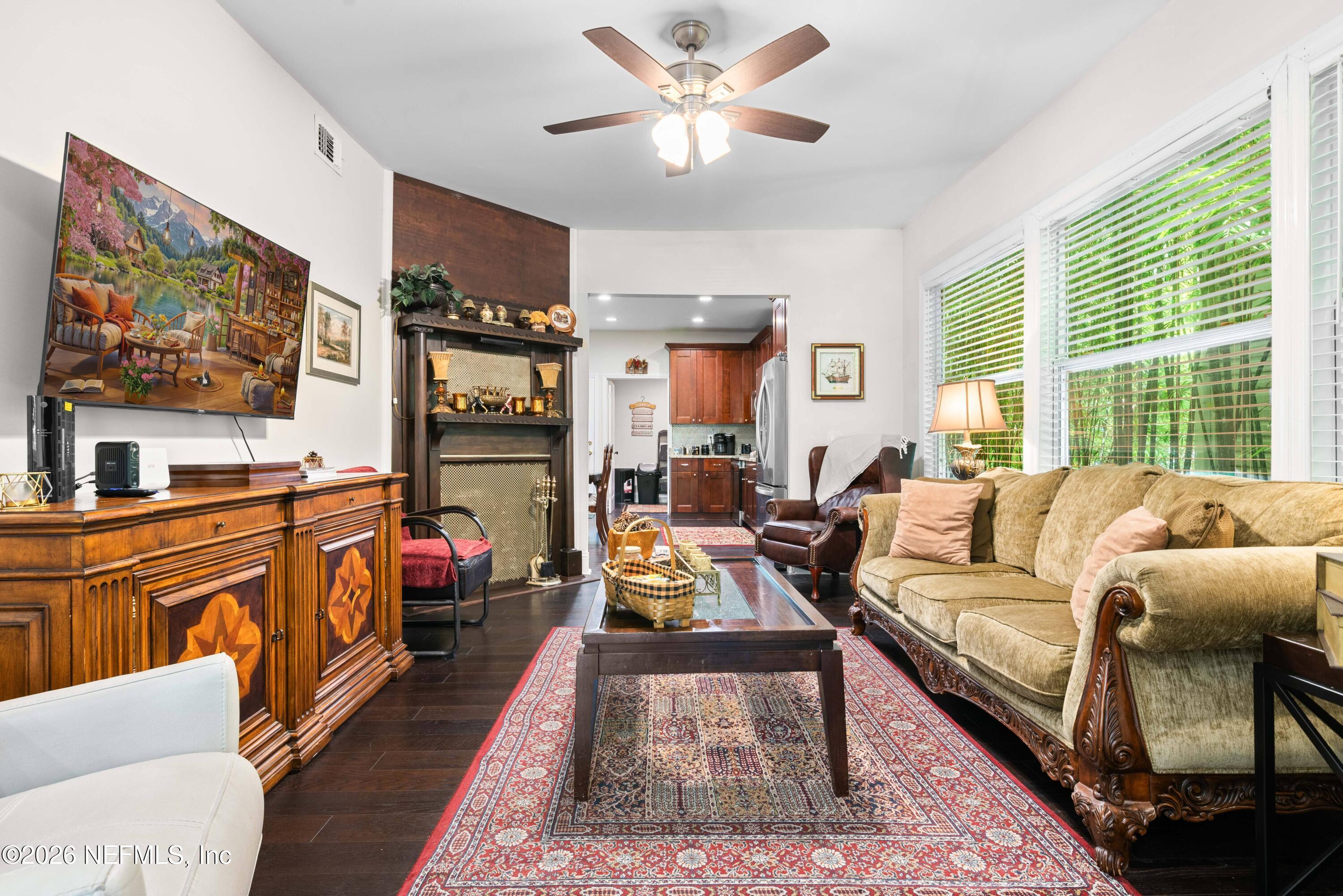 1138 Walnut Street Jacksonville, FL 32206 - Photo 6 of 37 a living room with furniture fireplace and flat screen tv
