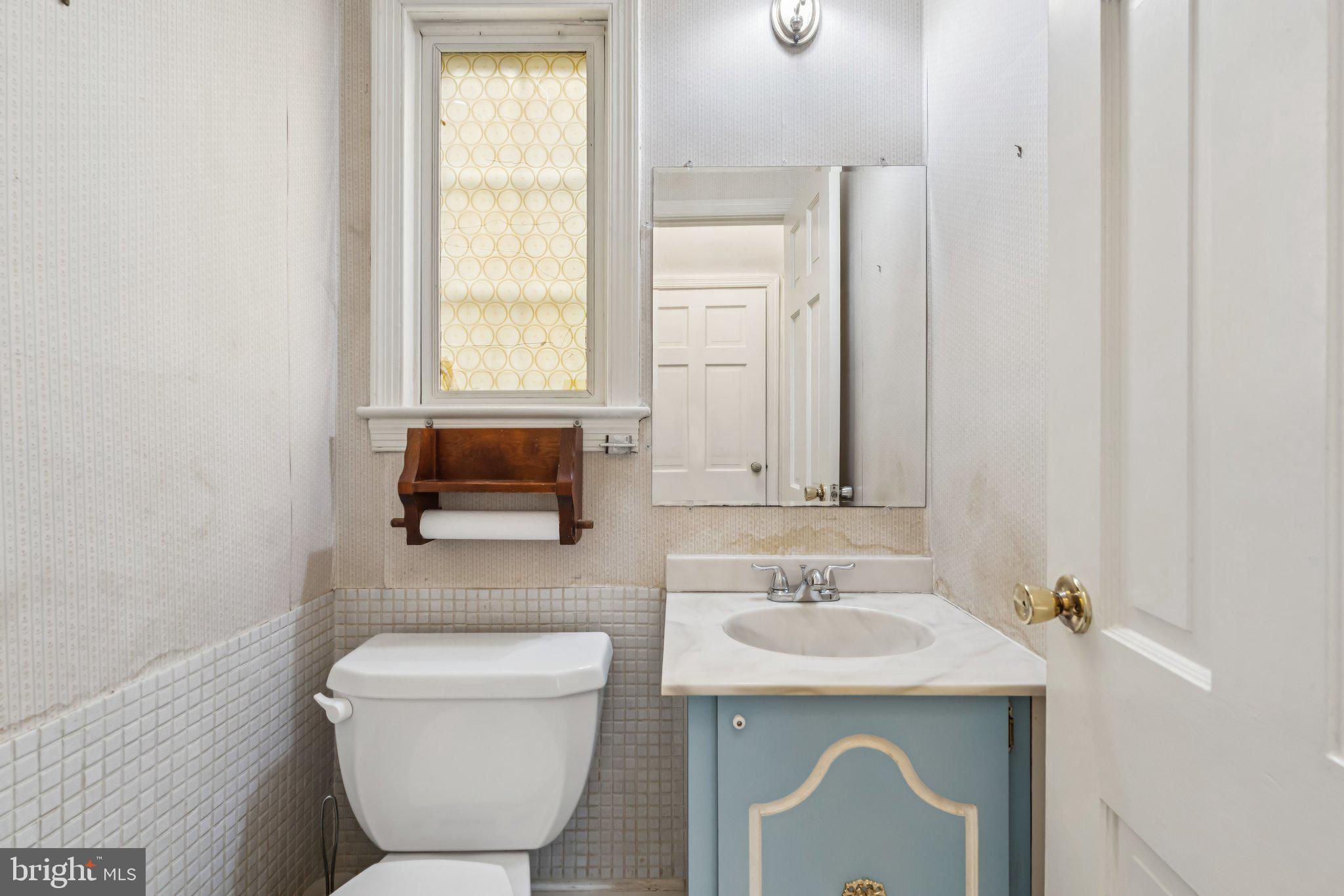 7201 Chestnut Street Chevy Chase, MD 20815 - Photo 11 of 34 Main level half bathroom