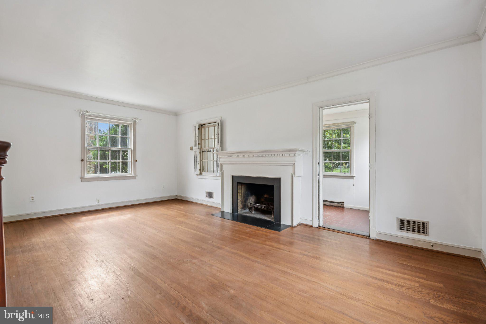 7201 Chestnut Street Chevy Chase, MD 20815 - Photo 2 of 34 Living room with wood burning fireplace