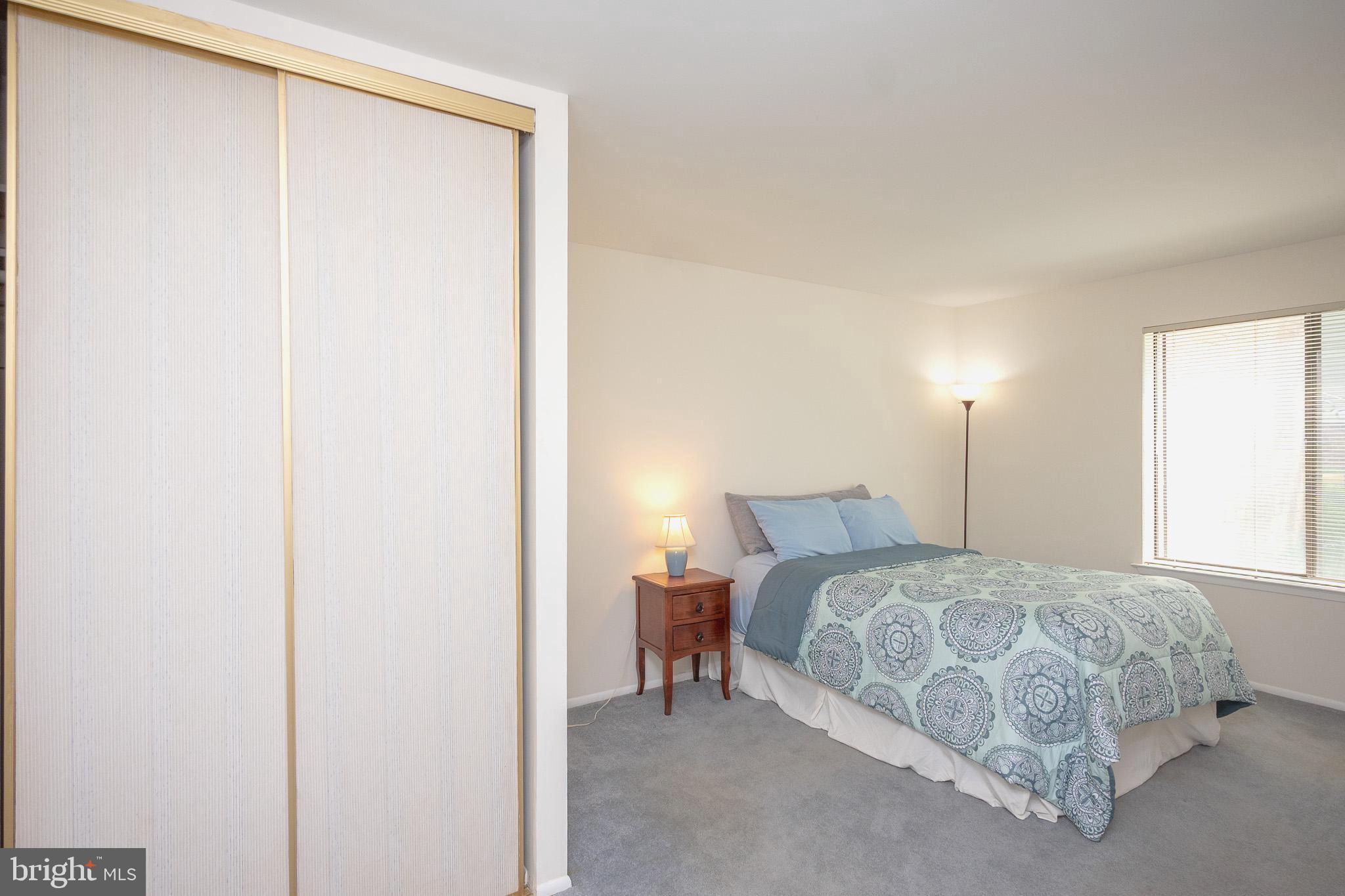 3160 Adderley Court, Unit 242A Silver Spring, MD 20906 - Photo 13 of 36 Serene bedroom with natural light.