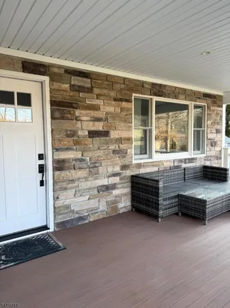 a outdoor space with the couches and a potted plant