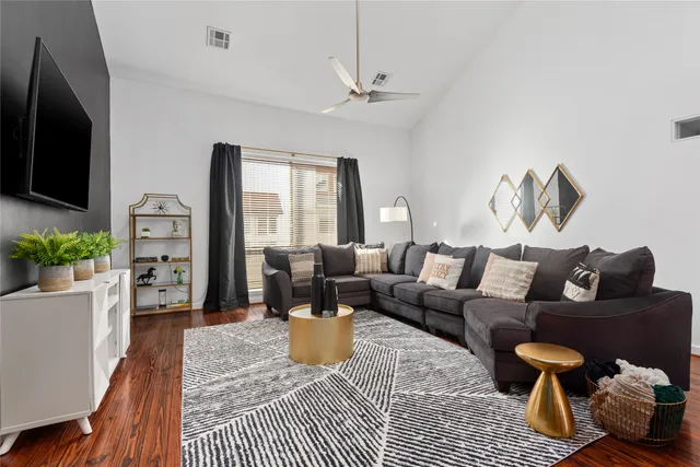 a living room with furniture fireplace and a flat screen tv
