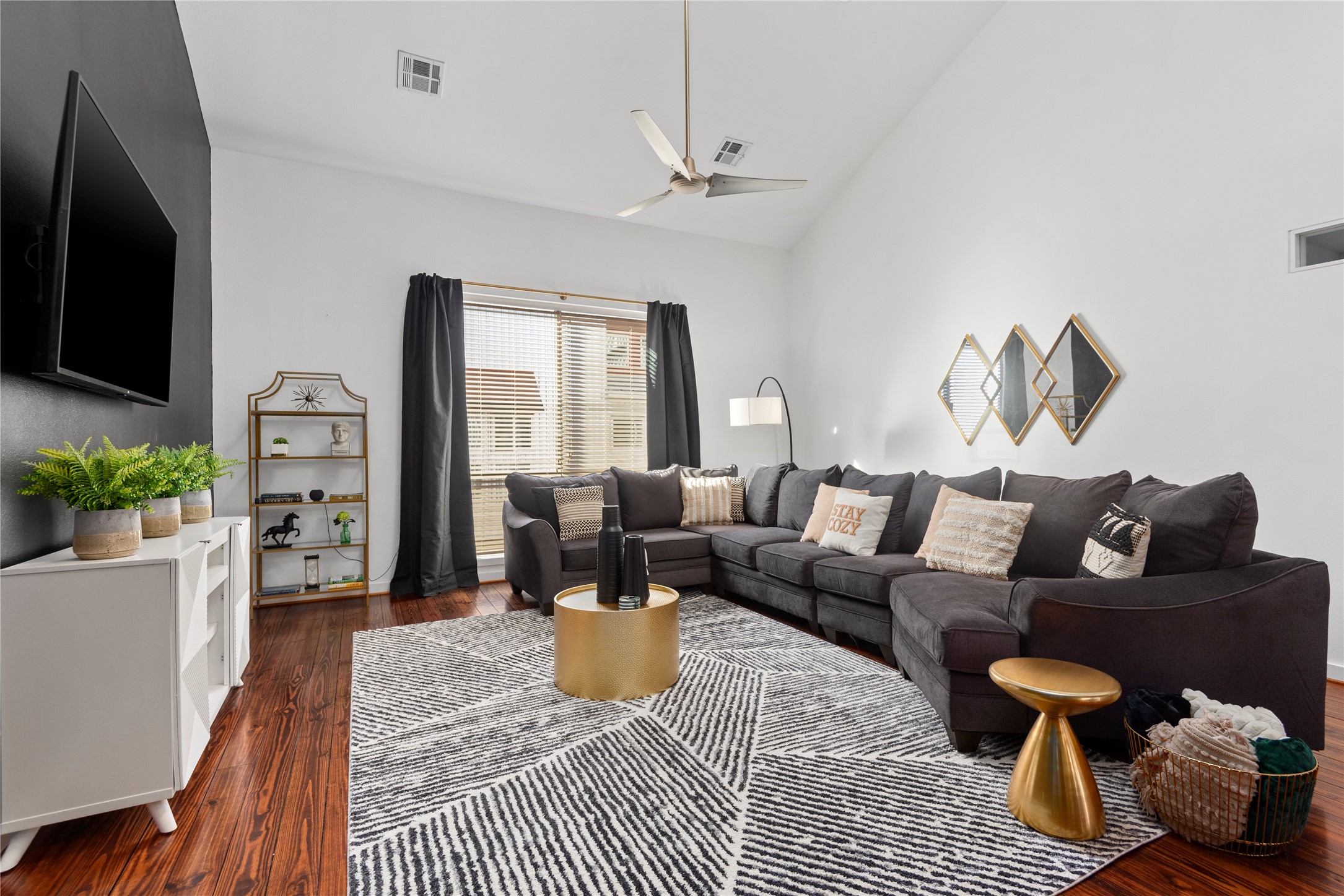 a living room with furniture fireplace and a flat screen tv