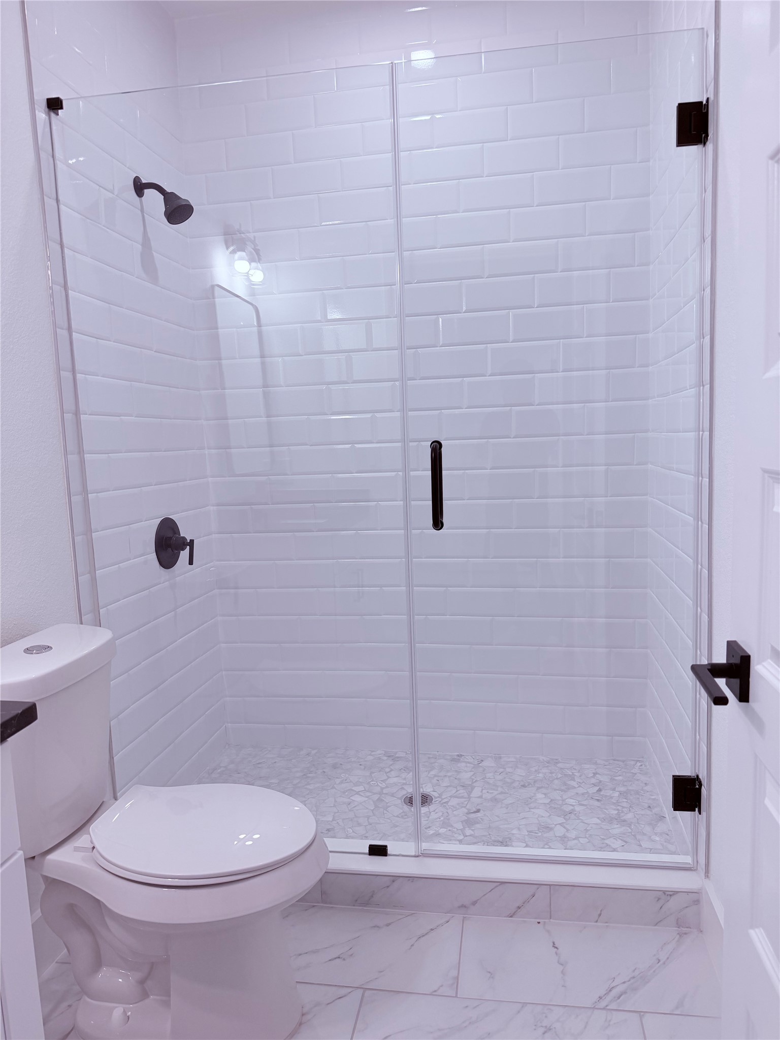 1417 Kramer Lane, Unit 7 Austin, TX 78758 - Photo 20 of 24 A pristine bathroom featuring a sleek glass-enclosed shower and contemporary finishes.