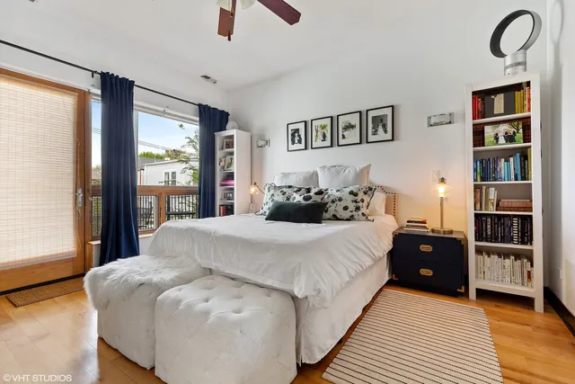 a bedroom with a large bed and a window