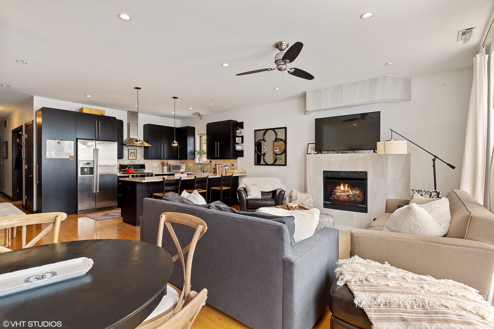 1842 North Damen Avenue, Unit 2N Chicago, IL 60647 - Photo 8 of 14 a living room with furniture and a fireplace