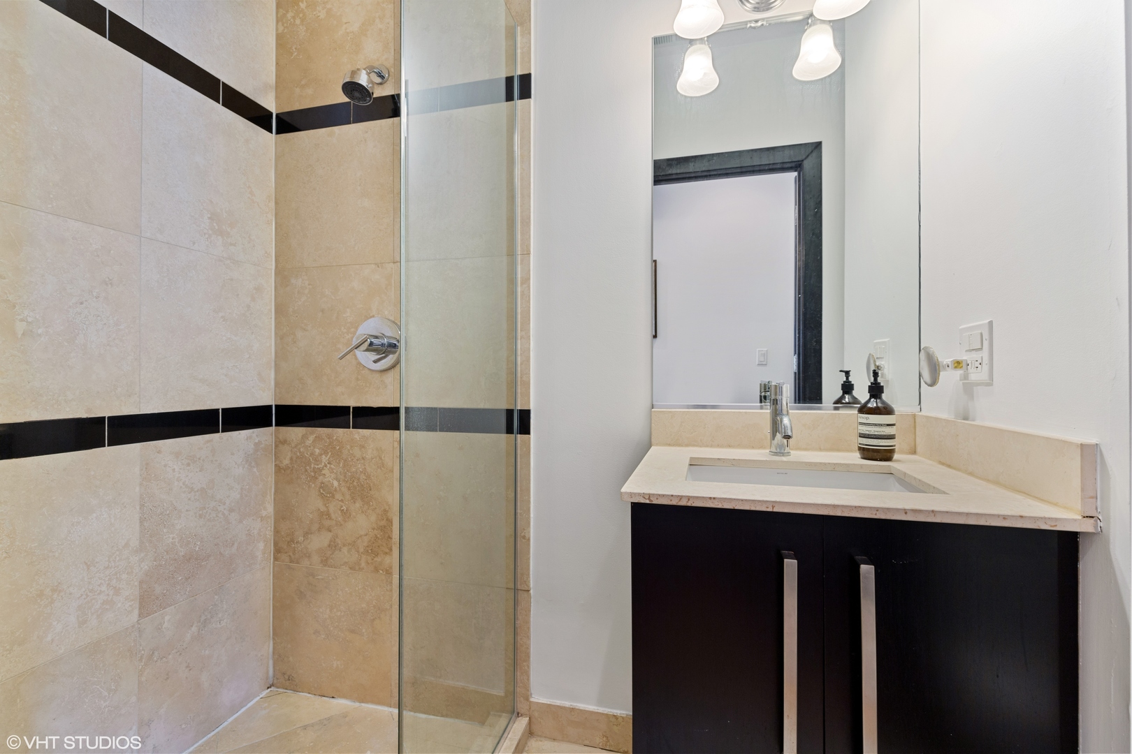 1842 North Damen Avenue, Unit 2N Chicago, IL 60647 - Photo 10 of 14 a bathroom with a double vanity sink and mirror