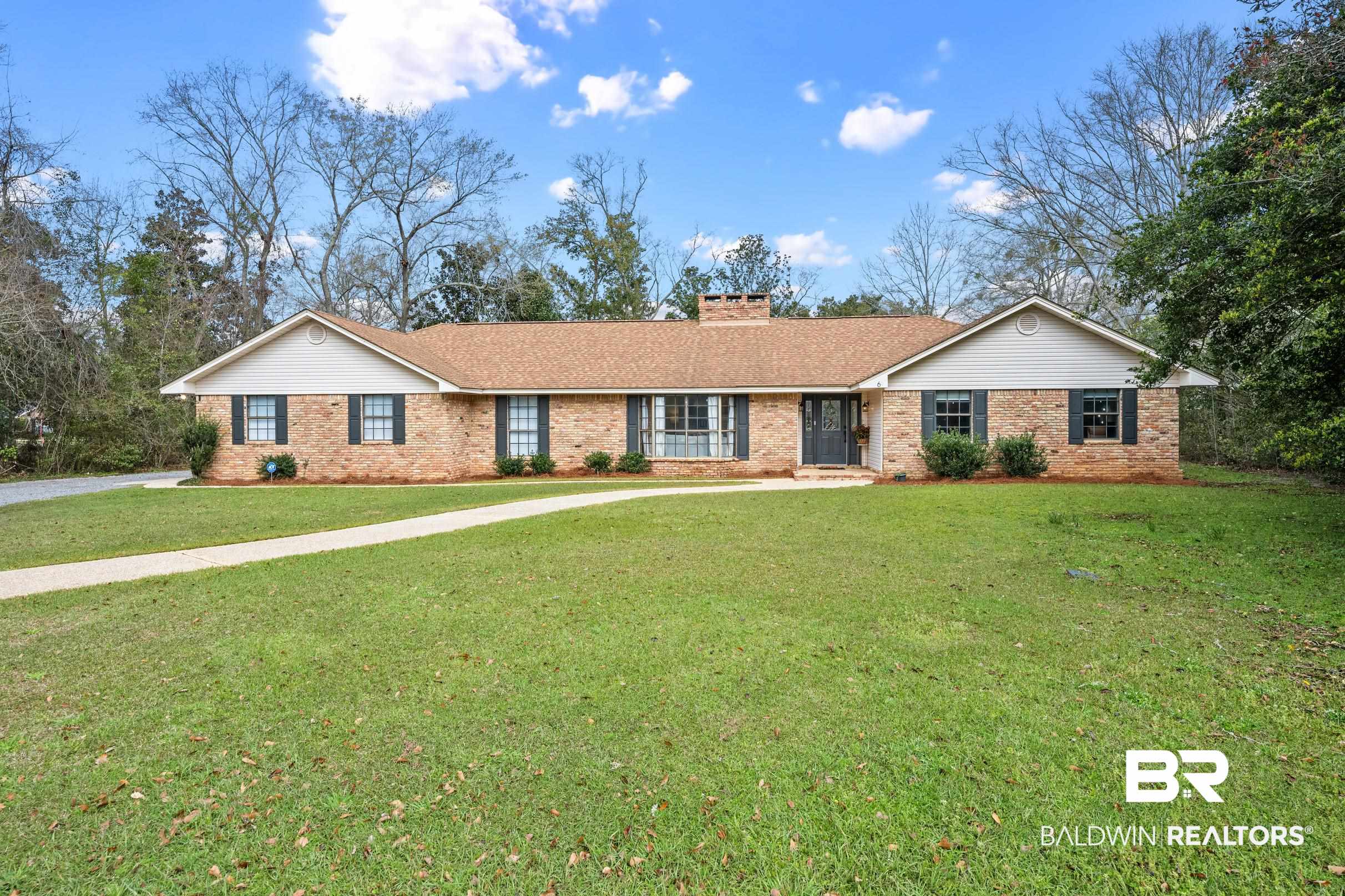 6 Wren Circle Foley, AL 36535 - Photo 2 of 55 Single story home with a front yard, brick siding, and a chimney