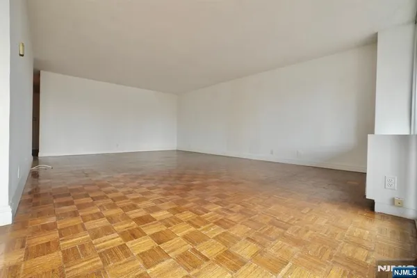 a kitchen with a sink a stove top oven and refrigerator