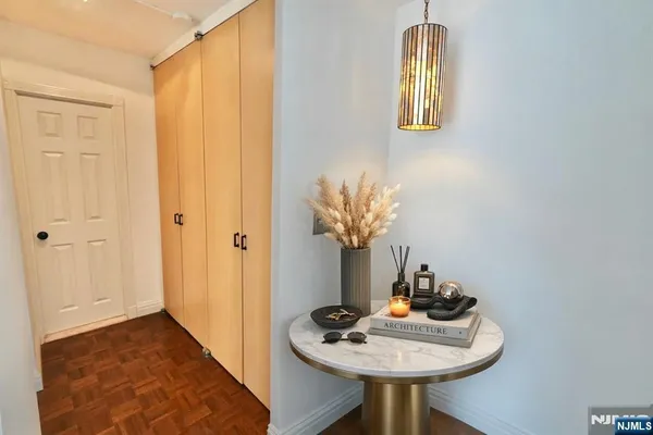 a dining room with furniture and wooden floor
