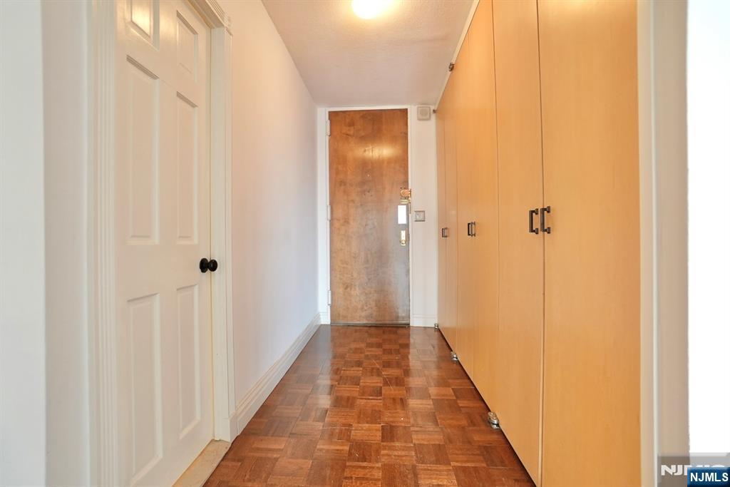 5 Horizon Road, Unit 203 Fort Lee, NJ 07024 - Photo 21 of 27 a view of a bathroom from a hallway