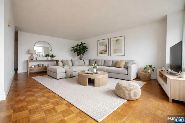 a living room with furniture and a flat screen tv