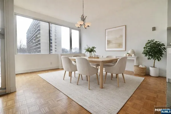 a view of a dining room with furniture and window