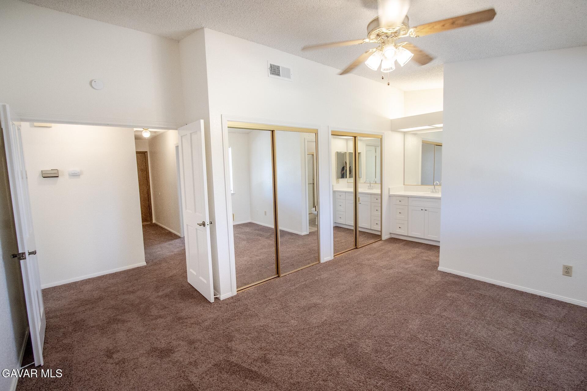 44318 33rd Street West Lancaster, CA 93536 - Photo 21 of 29 an empty room with windows and entrance