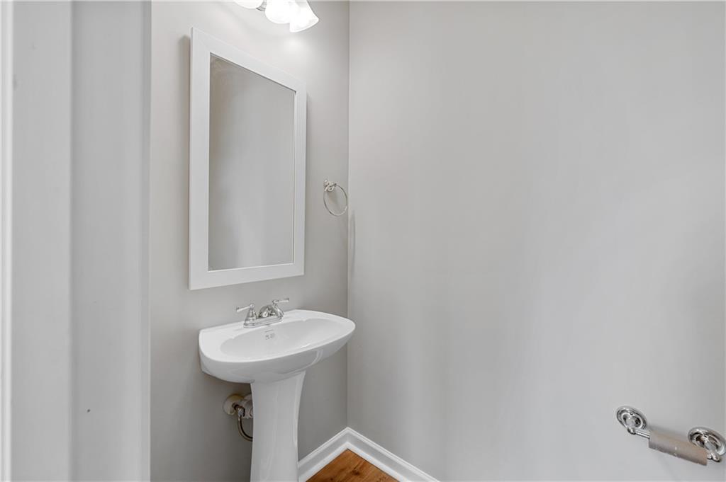 2832 Laurel Ridge Circle Atlanta, GA 30344 - Photo 16 of 28 a bathroom with a sink and a mirror
