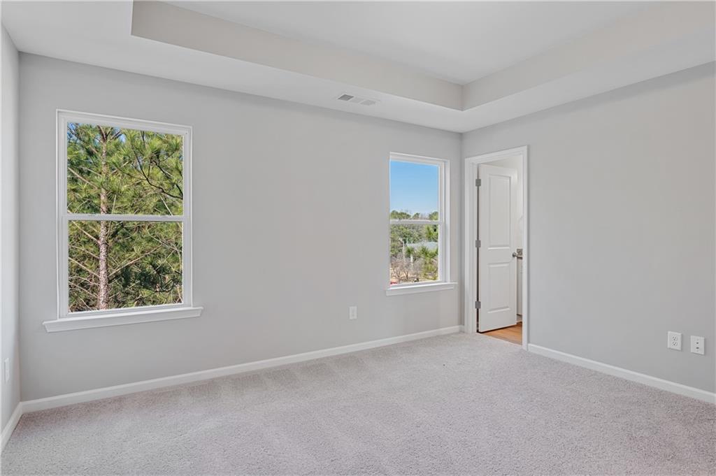 2832 Laurel Ridge Circle Atlanta, GA 30344 - Photo 18 of 28 an empty room with windows and closet