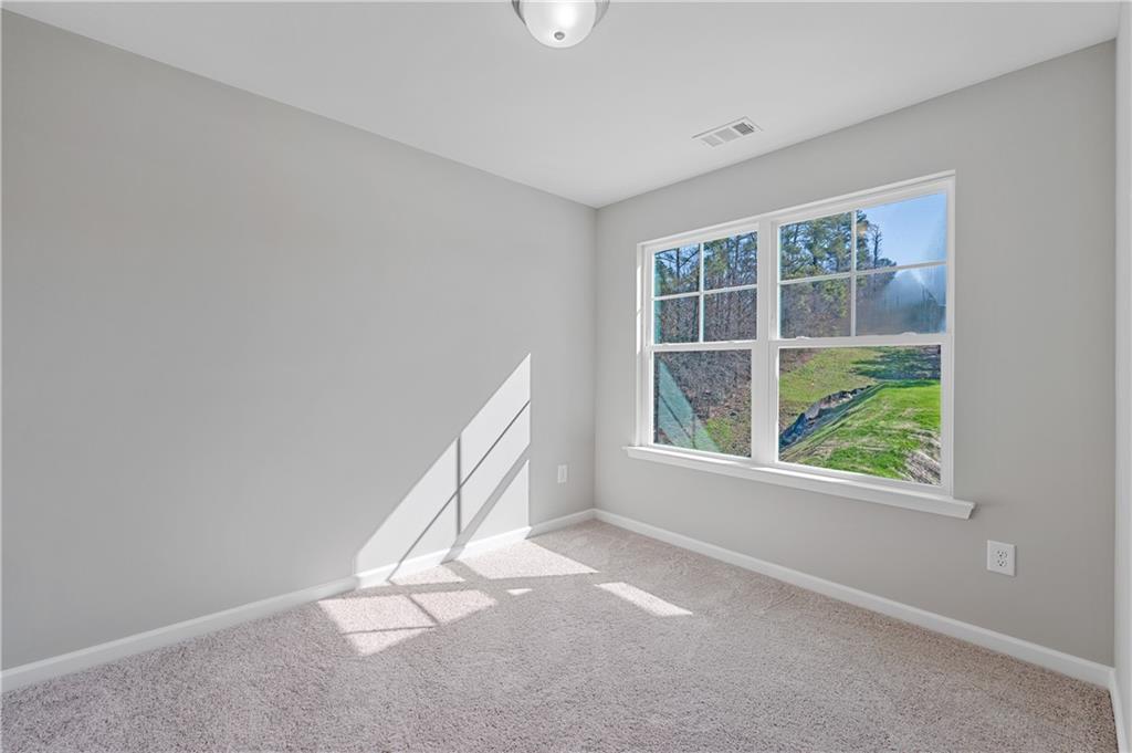 2832 Laurel Ridge Circle Atlanta, GA 30344 - Photo 22 of 28 an empty room with windows
