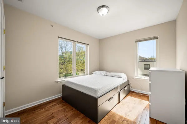 a room with a bed and a window