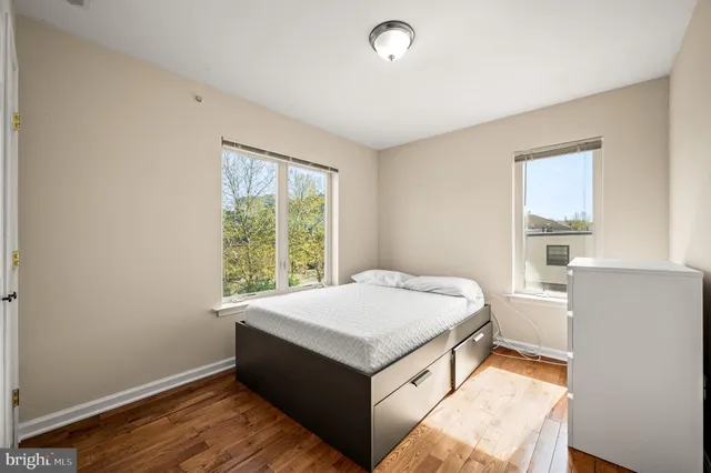 a room with a bed and a window