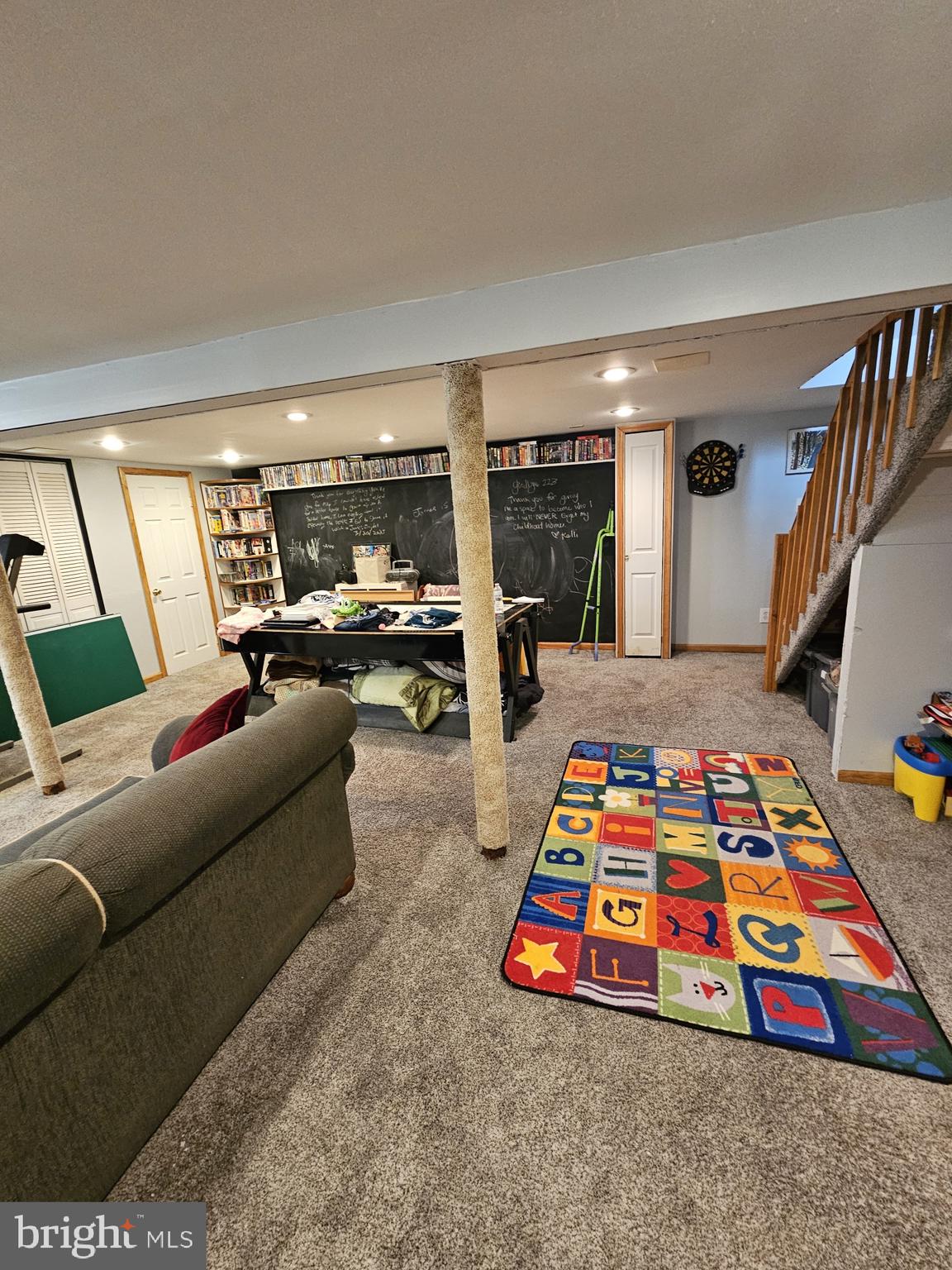 223 Valley Road Yardley, PA 19067 - Photo 16 of 44 a living room with furniture and a baby crib