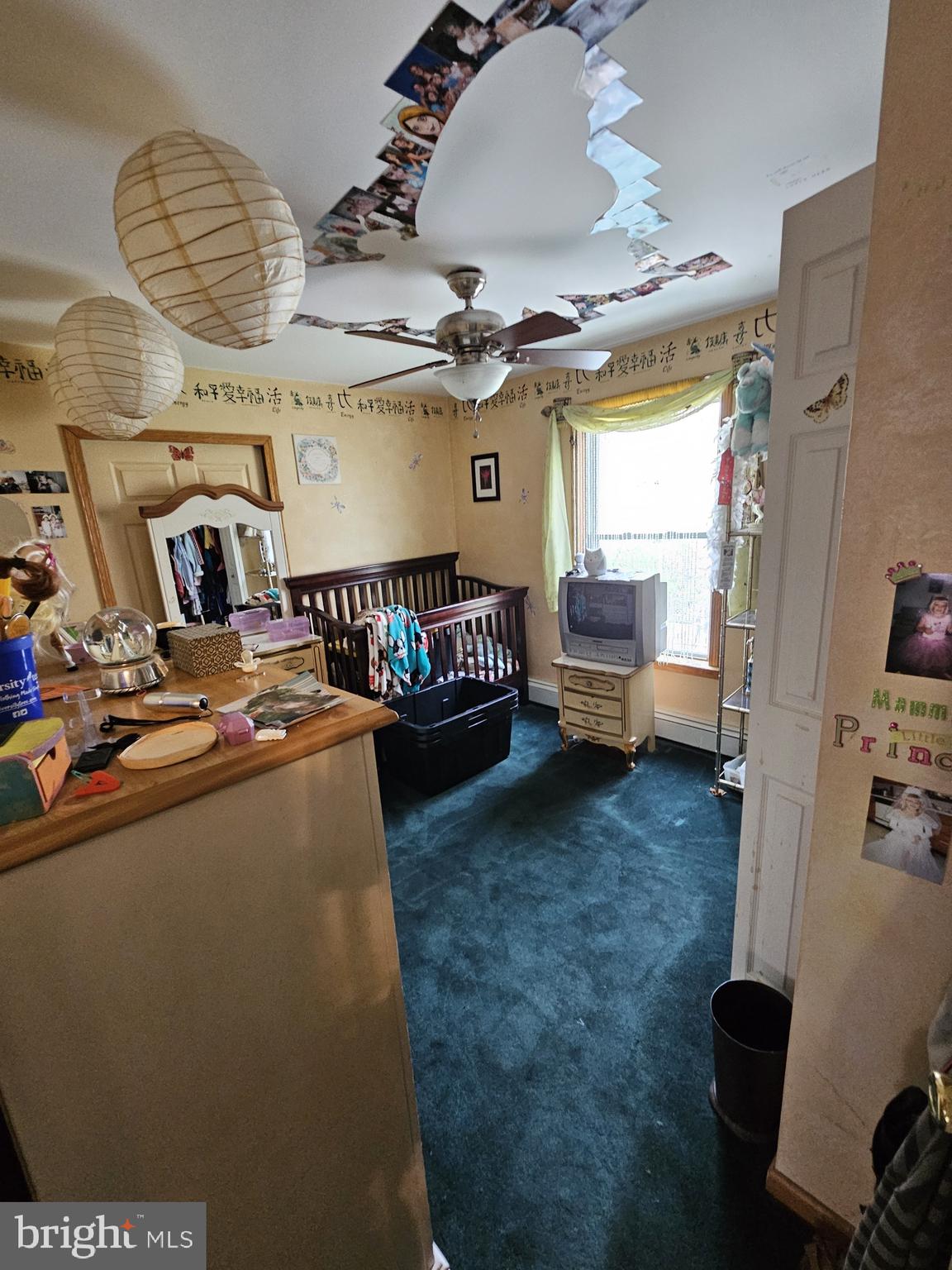 223 Valley Road Yardley, PA 19067 - Photo 27 of 44 a living room with furniture and a chandelier