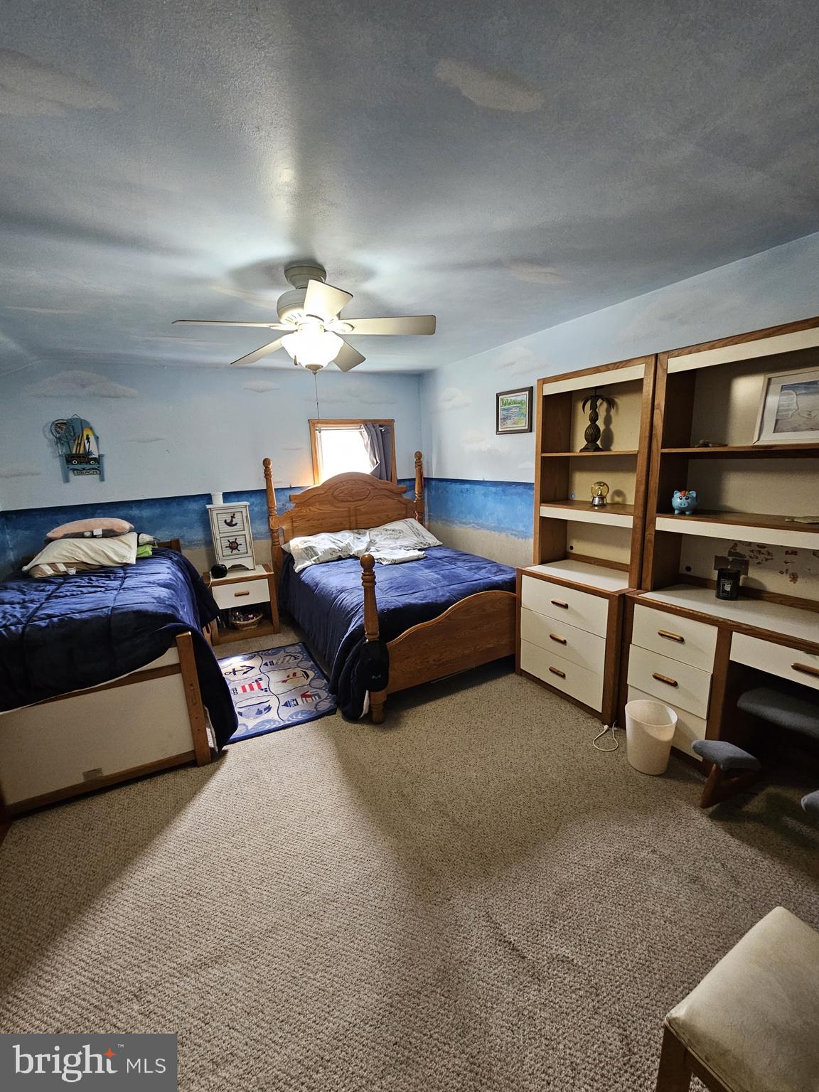 223 Valley Road Yardley, PA 19067 - Photo 31 of 44 a bedroom with a bed and a chandelier