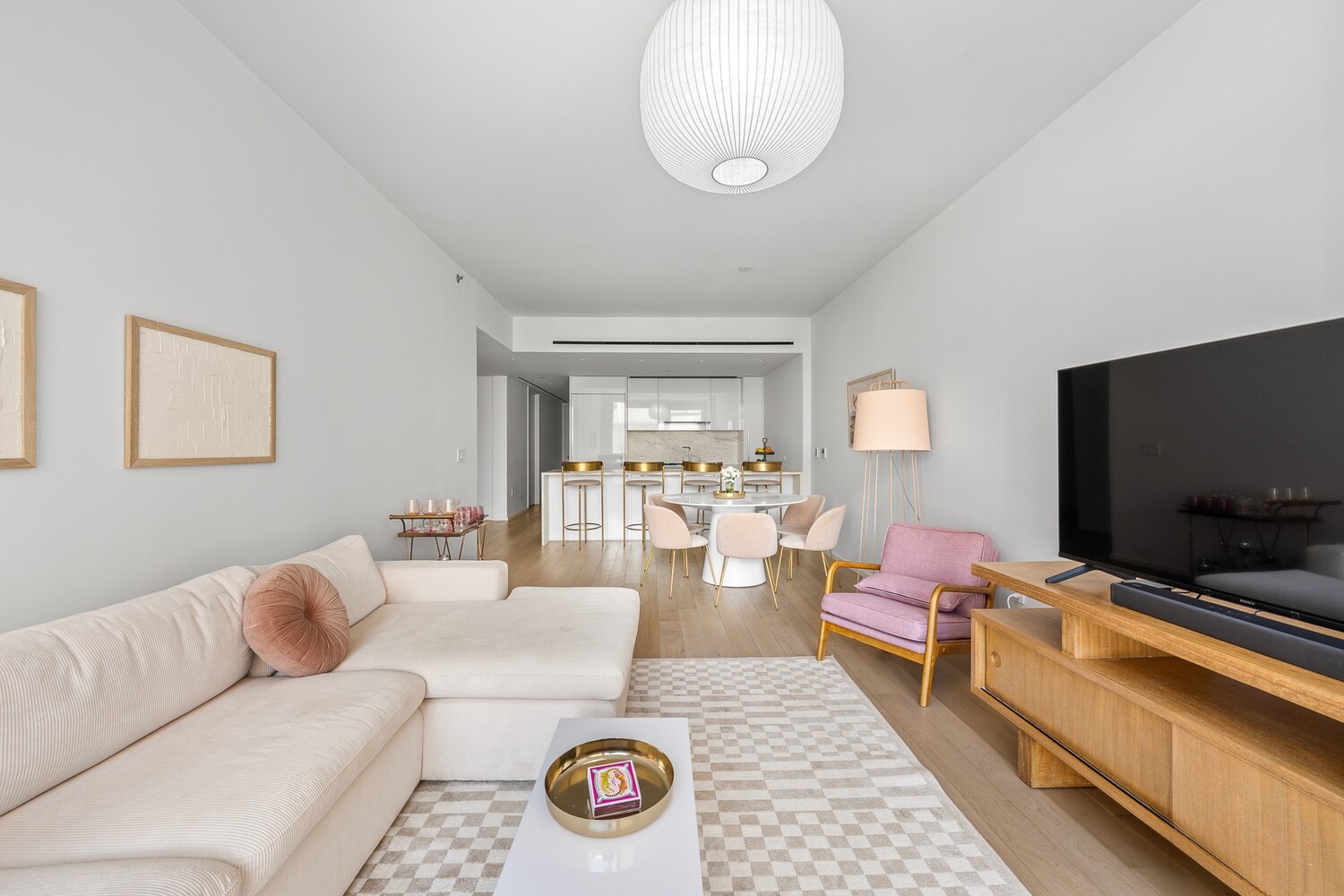 150 East 23rd Street, Unit 4C Manhattan, NY 10010 - Photo 3 of 12 a living room with furniture and a flat screen tv