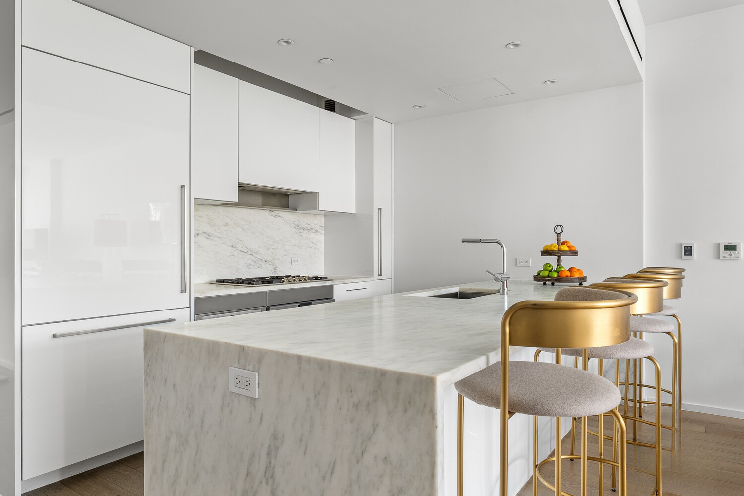 150 East 23rd Street, Unit 4C Manhattan, NY 10010 - Photo 5 of 12 a kitchen with a table and chairs in it