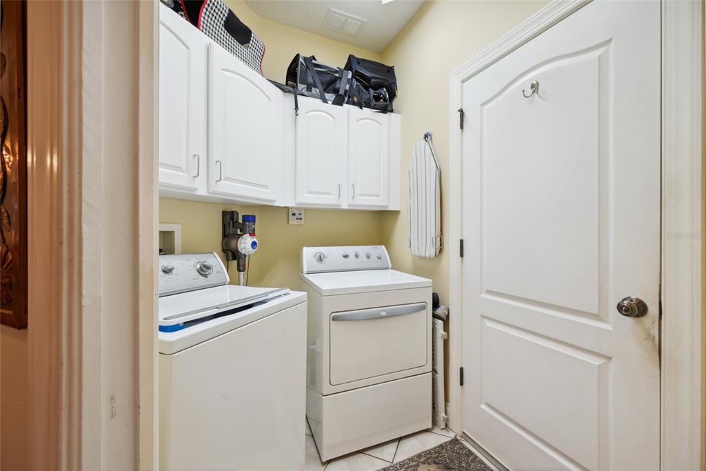 7246 Gaberia Road New Port Richey, FL 34655 - Photo 11 of 45 a utility room with dryer and washer