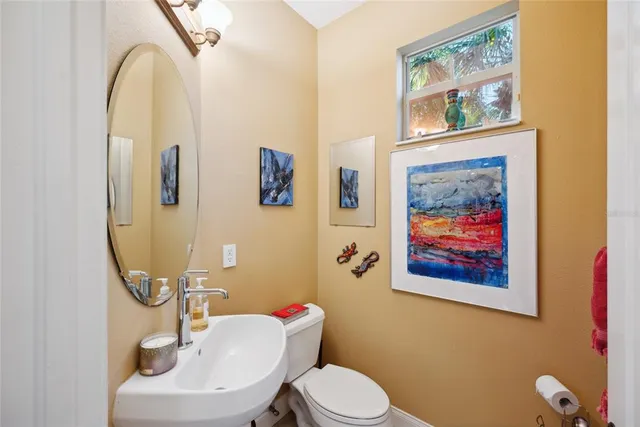 a kitchen with granite countertop a refrigerator and a stove top oven