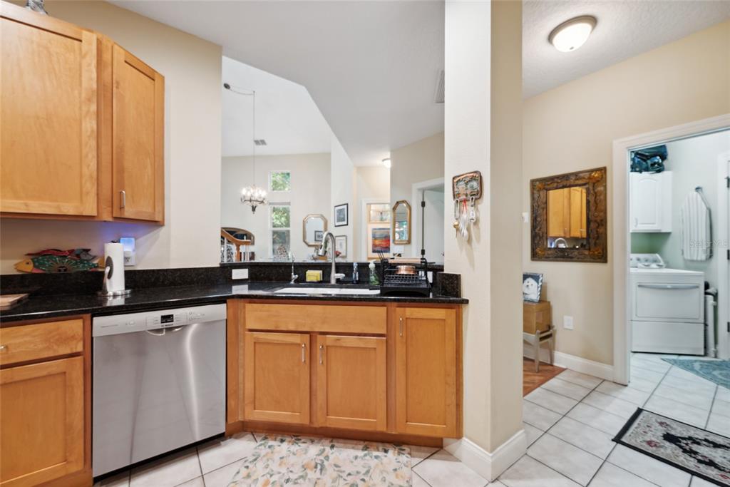 7246 Gaberia Road New Port Richey, FL 34655 - Photo 15 of 45 a kitchen with white cabinets and sink