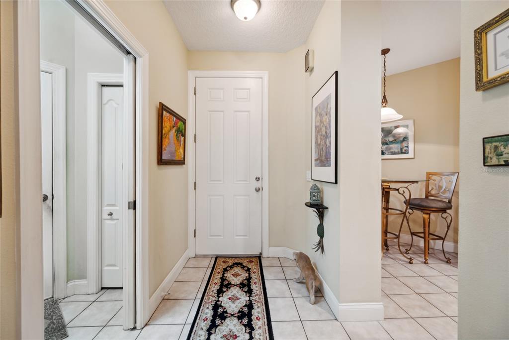 7246 Gaberia Road New Port Richey, FL 34655 - Photo 17 of 45 a view of a hallway and a livingroom with furniture