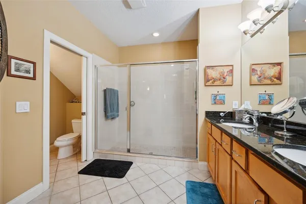 a white toilet sitting next to a bathroom sink
