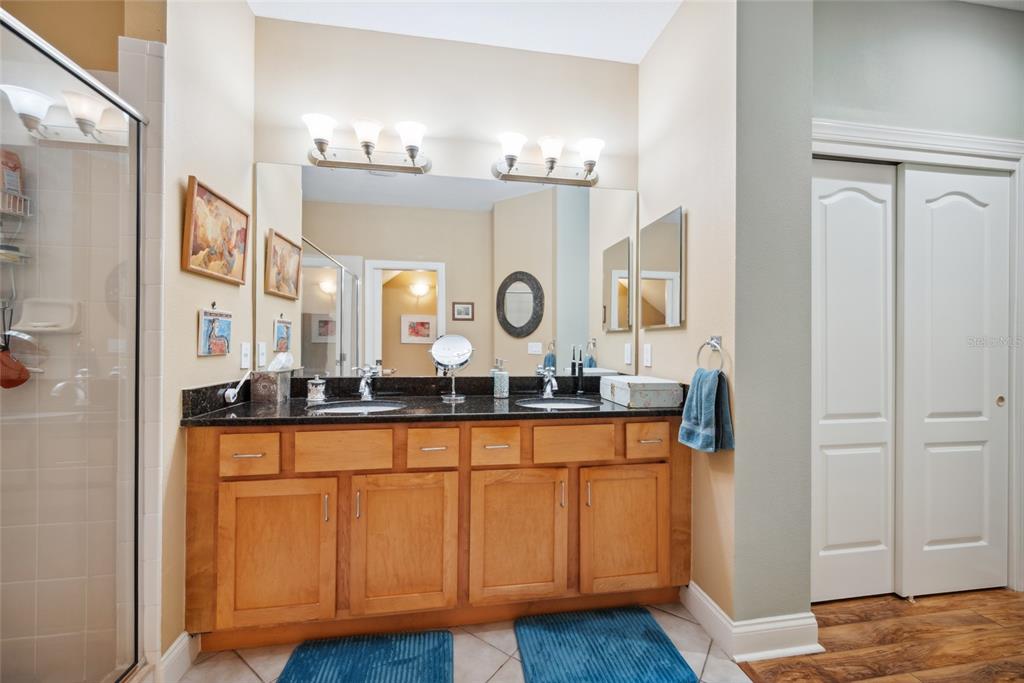 7246 Gaberia Road New Port Richey, FL 34655 - Photo 25 of 45 a bathroom with granite countertop a sink and a mirror