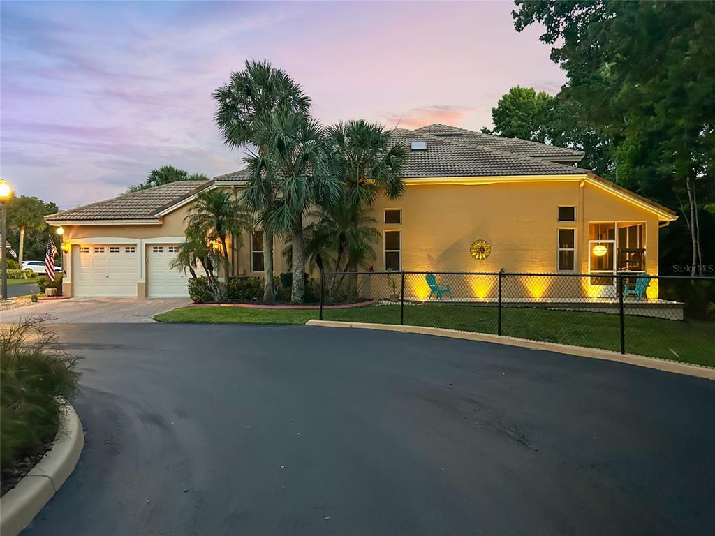 7246 Gaberia Road New Port Richey, FL 34655 - Photo 37 of 45 a view of a house with a big yard and large trees