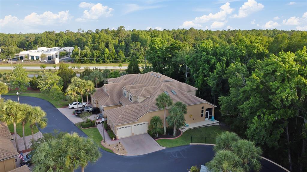 7246 Gaberia Road New Port Richey, FL 34655 - Photo 4 of 45 an aerial view of a house with yard lake and outdoor seating
