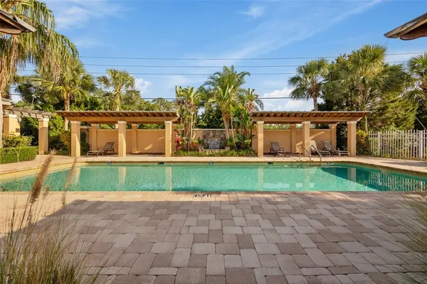 a view of a swimming pool with a yard