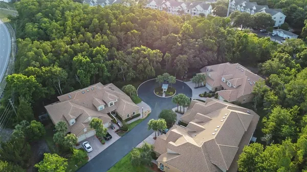 an aerial view of a house with garden space and street view