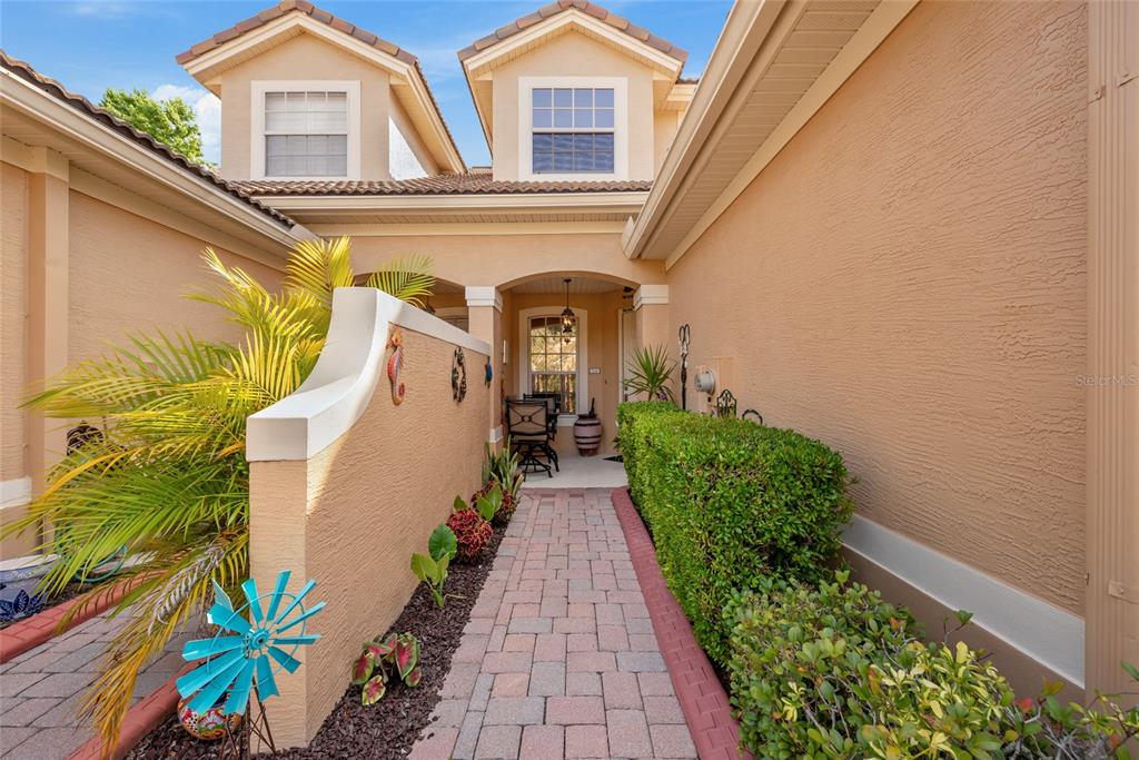 7246 Gaberia Road New Port Richey, FL 34655 - Photo 8 of 45 a view of a pathway along with potted plants