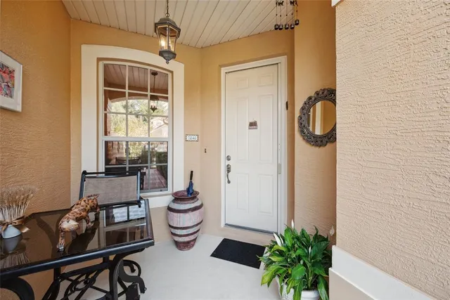 a very nice looking open kitchen with stainless steel appliances granite countertop a refrigerator and a stove top oven