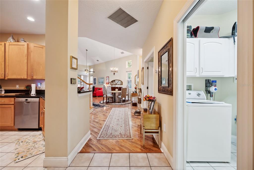 7246 Gaberia Road New Port Richey, FL 34655 - Photo 10 of 45 a very nice looking open kitchen with stainless steel appliances granite countertop a refrigerator and a stove top oven