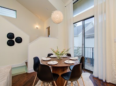 4510 Maxie Street, Unit B Houston, TX 77007 - Photo 26 of 39 a view of a dining room with furniture and chandelier